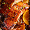 Red fish baked in a marinade with orange jam