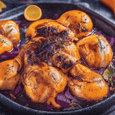 Chicken baked with red onions and orange-wine sauce