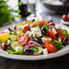 A plate of colorful and refreshing Greek salad