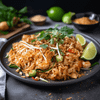 A plate of spicy and aromatic pad Thai